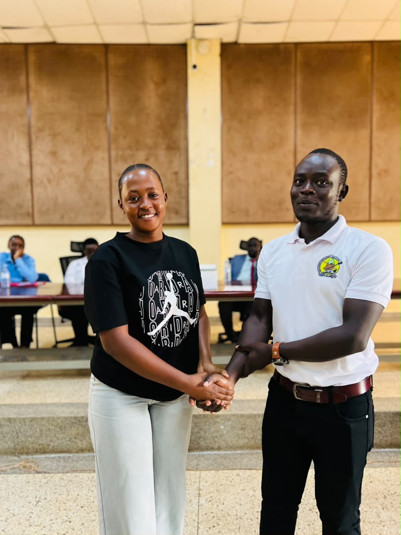 Association members sharing a handshake during the event