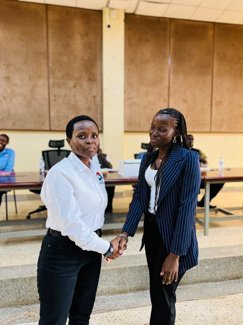 Two students posing after a certificate presentation