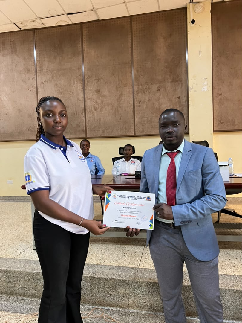 Students posing after a certificate presentation in the hall